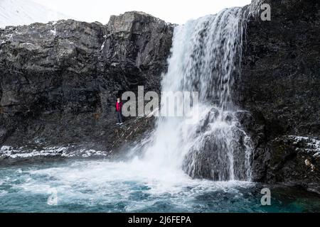 Photograph of Skœtafoss, a remote waterfall in eastern Iceland on an overcast day. Stock Photo