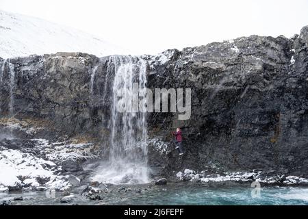 Photograph of Skœtafoss, a remote waterfall in eastern Iceland on an overcast day. Stock Photo