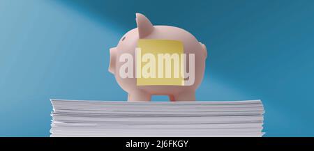 Piggy bank with blank sticky note on a pile of paperwork: saving money and investments concept Stock Photo