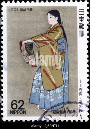 Elegant geisha on japanese postage stamp Stock Photo