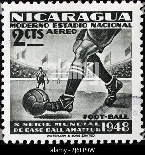 Footballer on vintage posage stamp from Nicaragua Stock Photo