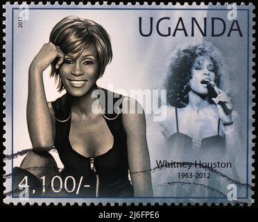 Portraits of Whitney Houston on postage stamp of Uganda Stock Photo