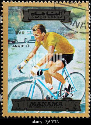 Road racing cyclist Jacques Anquetil on postage stamp Stock Photo