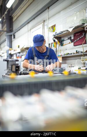the working day of a person working in a factory Stock Photo