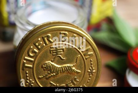 Viersen, Germany - May 9. 2022: Closeup of jar lid cover with asian analgetic heat tiger balm rub ointment Stock Photo