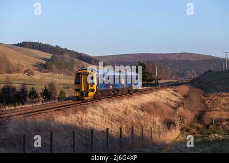 Scotrail class 158 DMU train 158728 passing the open countryside on the borders railway, near Heriot, Scotland UK Stock Photo