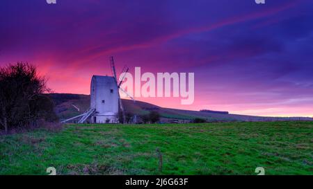 Brighton, UK - January 4, 2022: Mid-winter sunset over Ashcombe Mill near Kingston and Brighton on the South Downs, East Sussex, UK Stock Photo