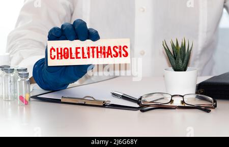 Cholelithiasis Gallstones word, medical term word with medical concepts in blackboard and medical equipment. Stock Photo