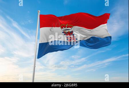 official flag of Unofficial province of Luxembourg, Belgium at cloudy sky background on sunset, panoramic view. Belgian travel and patriot concept. co Stock Photo