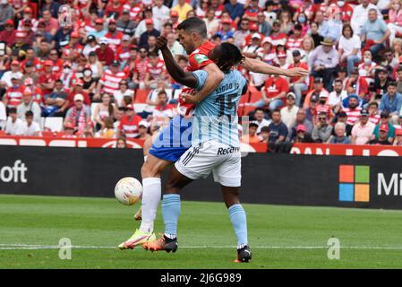 Jorge Molina of Granada CF competes for the ball with Joseph Aidoo of RC Celta during the Liga match between Granada CF and RC Celta at Nuevo Los Carmenes Stadium on  May 1, 2022 in Granada, Spain (Photo by José M Baldomero / Pacific Press/Sipa USA) Stock Photo