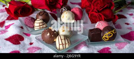 roses and luxury chocolates in a delicious panorama Stock Photo