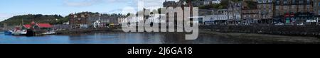 Panoramic view of Scottish coastal town with harbour and traditional stone buildings Stock Photo