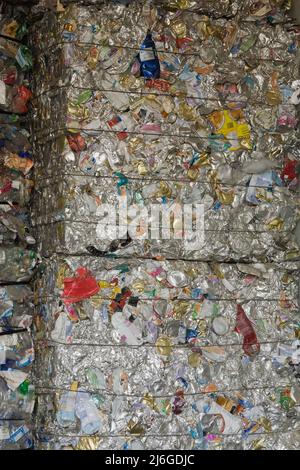 Bales of recyclable aluminum cans and containers at sorting centre. Stock Photo