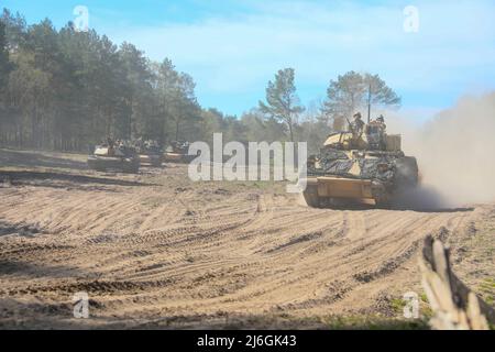 U.S. Army Soldiers assigned to the 3rd Armored Brigade Combat Team, 4th Infantry Division, scouts conduct a situational exercise at Drawsko Pomorskie, Poland, April 29, 2022. The 3/4 ABCT is among other units assigned to V Corps, America’s forward-deployed corps in Europe that works alongside NATO allies in joint, bilateral, and multinational training exercises. (U.S. Army photo Sgt. Andrew Greenwood) Stock Photo