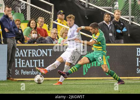 EAST HARTFORD, CT - July 09: Tampa Bay Rowdies midfielder Laurence Wyke  (27) grabs the shirt of Hartford Athletic forward Prince Saydee (7) in an  attempt to slow him down during a