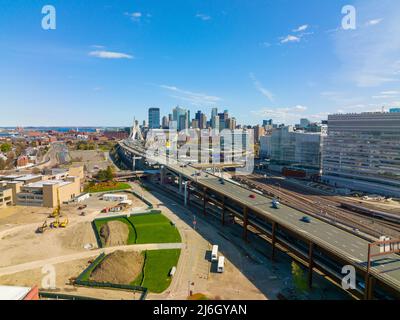 Boston downtown financial district skyline and Leonard Zakim Bridge aerial view, with Boston Harbor and Charles River at the background, Boston, MA Stock Photo