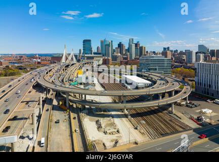 Boston downtown financial district skyline and Leonard Zakim Bridge aerial view, with Boston Harbor and Charles River at the background, Boston, MA Stock Photo