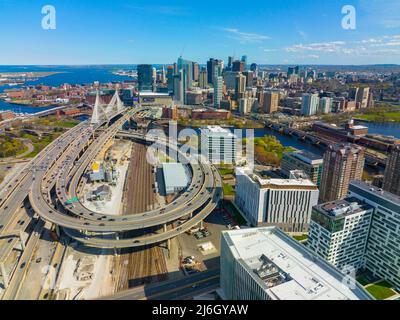 Boston downtown financial district skyline and Leonard Zakim Bridge aerial view, with Boston Harbor and Charles River at the background, Boston, MA Stock Photo