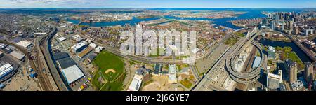 Boston downtown financial district skyline and Leonard Zakim Bridge aerial view, with Boston Harbor and Charles River at the background, Boston, MA Stock Photo