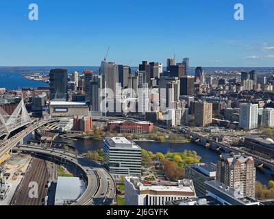 Boston downtown financial district skyline and Leonard Zakim Bridge aerial view, with Boston Harbor and Charles River at the background, Boston, MA Stock Photo