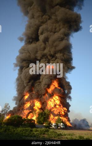 Firefighters try to extinguish the fire broke out at an oil tanker ...