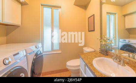 Panorama Small laundry and bathroom interior with narrow window Stock Photo