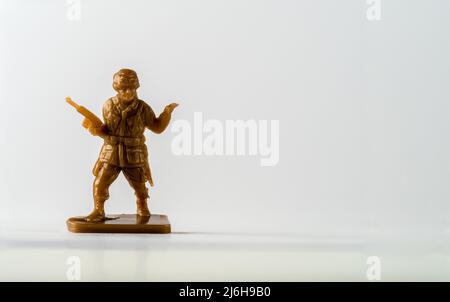 Childs Plastic toy soldier platoon leader in brown on a pedestal Stock Photo