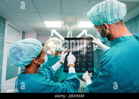 Portrait of intellectual healthcare professionals with at x-ray radiographic image, ct scan, mri Stock Photo