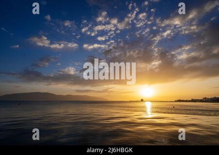 Beautiful sunlight with clouds at sunset in the Mediterranean Sea in Albania Stock Photo
