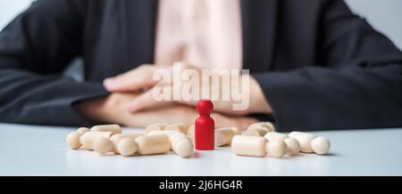 Businesswoman hand pulling leader man wooden from crowd of employees. Toxic People, Human resource management, Recruitment, Teamwork and leadership Co Stock Photo