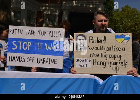 Protesters hold placards during the rally. The Russians protested in solidarity with the Russian anti-war movement and for the release of political prisoners, in front of the Russian embassy in London. Stock Photo