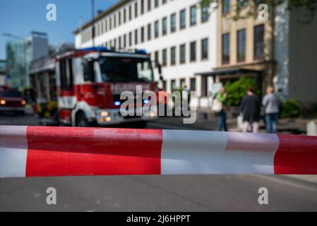 02 May 2022, Rhineland-Palatinate, Trier: Fire engines stand in front of the Trier District Court. A smoldering fire had broken out in the basement of the building in the morning, and numerous people were evacuated. Photo: Harald Tittel/dpa Stock Photo