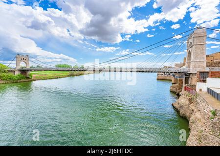 El Pont Penjant de Amposta located in the Ebro delta, Tarragona province, Catalonia Spain, is a suspension bridge inaugurated in 1920. Stock Photo