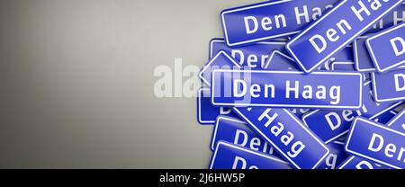 Multiple 'Den Haag' / 'The Hague' city limit signs on a heap. The Hague / Den Haag is the royal capital of the Netherlands. The typical blue city limi Stock Photo