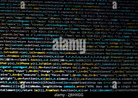 blue yellow code lines on black computer screen right across view. colorful coding cyber space creative concept back ground idea. Stock Photo