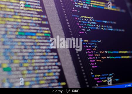 coding lines on the laptop screen. selective focus with some part blurred various colors. Stock Photo