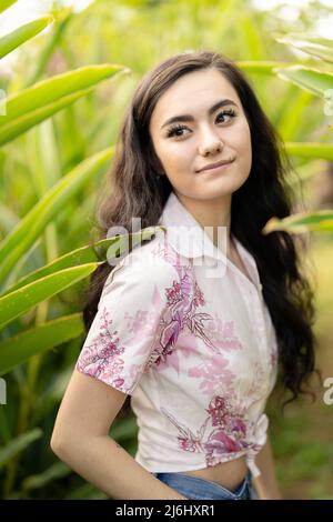 Young woman wearing Kariyushi shirt (かりゆしウェア, kariyushi wear in Okinawa, Japan Stock Photo