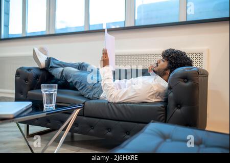 Focused businessman reading documents in his office Stock Photo