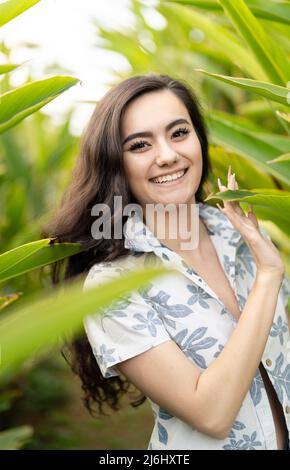 Young woman wearing Kariyushi shirt (かりゆしウェア, kariyushi wear in Okinawa, Japan Stock Photo