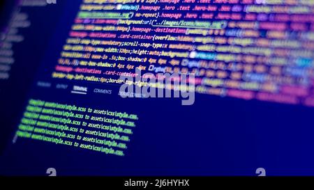many colors half blurred codes line on screen. green commands one under the other. selective focus creative software idea photo concept. Stock Photo