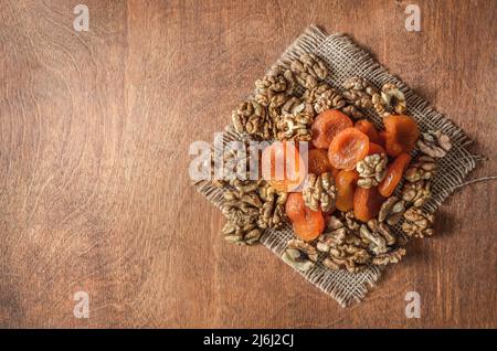 nuts and other fruits on a wooden background Stock Photo