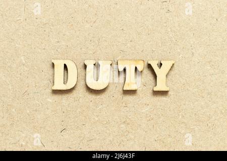 Alphabet letter in word duty on wood background Stock Photo