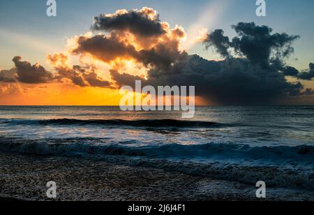 May golden light on Dunwich beach Suffolk early in the morning east Anglia England Stock Photo