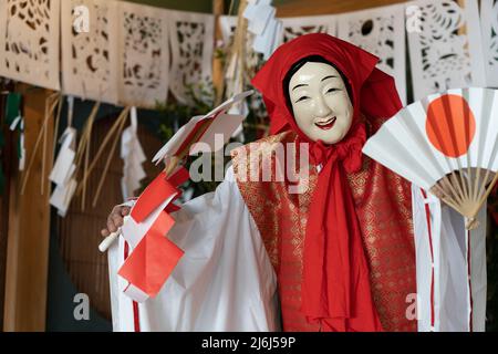 Fujisaki-san, a master of Kagura the Shinto ritual performance telling the stoires of the gods. Here performing the Uzume Dance, Takachiho, Kyushu, Ja Stock Photo