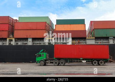 business logistics concept.  truck delivering container to warehouse or cargo freight ship at the port for international logistic import and export. Stock Photo