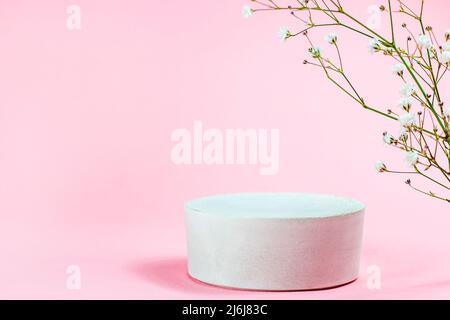 White empty round podium with platform for product presentation on soft pastel pink background. Minimal geometric blank stage decoration as a template Stock Photo