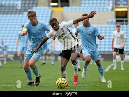 Coventry’s Callum Perry battles for the ball Ipswich’s Afi Adebayo during the Premier League Development Cup Final at the Coventry Building Society Arena, Coventry. Picture date: Monday May 2, 2022. Stock Photo