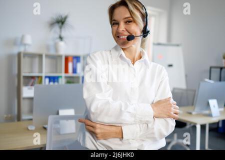 Portrait of smiling female support center operator at office Stock Photo