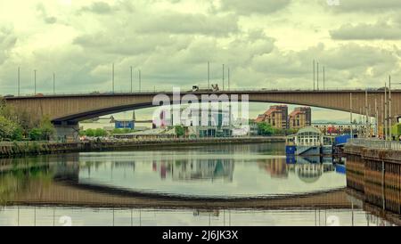 Glasgow, Scotland, UK  May 2nd, 2022. UK  Weather: :  Kingston bridge  over the river clyde with the old renfrew ferry now the ferry venue underneath on a Cloudy Mayday holidat Monday was dull in every sense with stay at homers flooding the town centre streets and shops. Credit Gerard Ferry/Alamy Live News Stock Photo