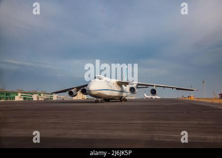 Aktau, Kazakhstan - May 21, 2012: International airport Aktau. Giant heavy Soviet cargo plane Antonov-124 Ruslan on the ground. Nice blue sky with clo Stock Photo